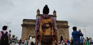 Person with bag-pack in front of Gateway of India, Mumbai